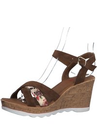 Brown suede wedge sandal with floral patterned strap, cork-textured sole, white outsole, and adjustable ankle strap.