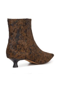Brown leopard print ankle boots made of soft fur with a pointed toe and a small black kitten heel. The design features textured accents.