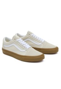 Beige mokkasinsneakers med hvite skinnakenter, rund tå, flate snørebånd og gummierte såler. Klassisk design med sidestøtte.
