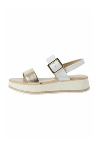 Sandali platform con una cinghia metallica dorata, cinghia alla caviglia in pelle bianca con fibbia e suola in gomma beige con grip testurizzato.