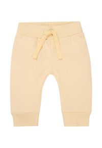 Joggers in cotone giallo chiaro con polsini a coste e cintura elastica, dotati di chiusura con coulisse e texture liscia.