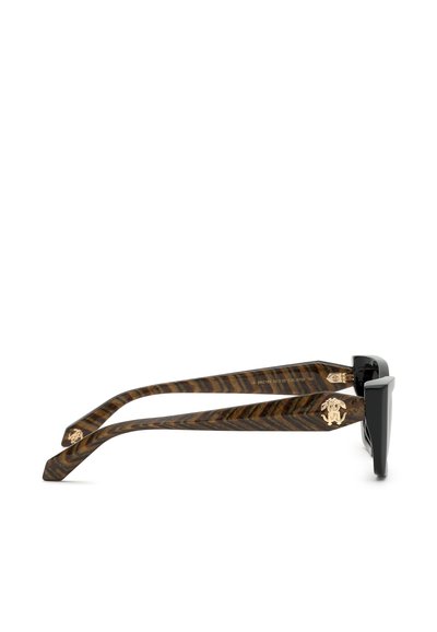 Tortoiseshell-patterned eyeglass arms with gold emblem and black rectangular frames shown from the side on white background.