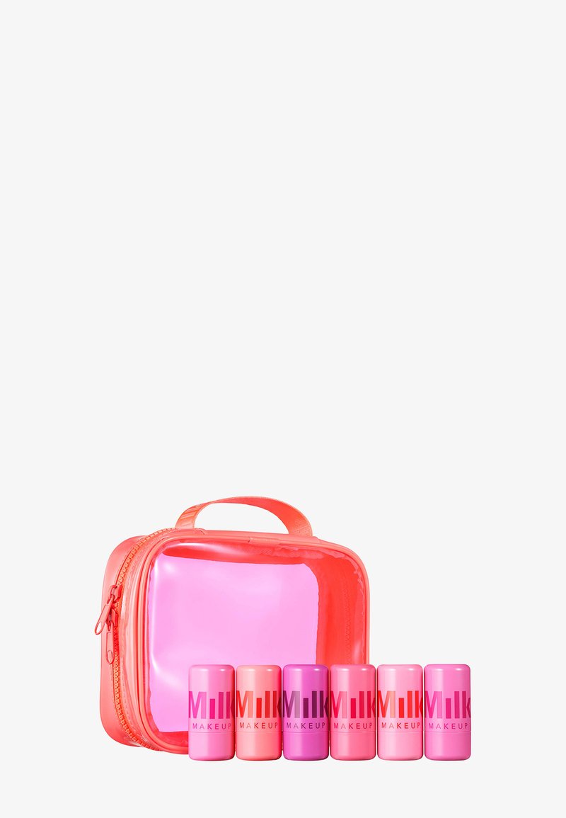 Cosmetic bag in bright orange with a transparent pink front, containing five colorful tubes labeled "MILK MAKEUP" in varying shades of pink.