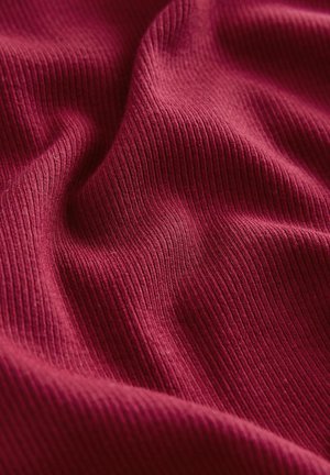 Burgundy ribbed fabric with soft texture, featuring subtle waves and folds. The pattern shows fine vertical lines across the surface.