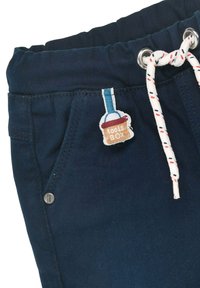 Marineblaue Hose mit elastischem Bund, ausgestattet mit einem Kordelzug und einem gestickten "tools BOX"-Patch auf der Vorderasche.