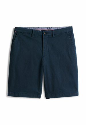 Marineblauwe herenshorts met een pasvorm, voorzien van een knoop- en ritssluiting, ceintuurlussen en zijzakken, plat gelegd op een witte achtergrond.