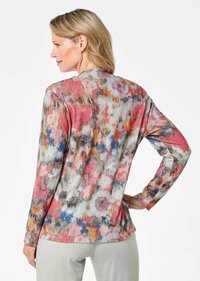Langärmliges Oberteil mit einem bunten Blumenmuster in Pink-, Blau- und Grautönen; weicher, leichter Stoff mit lockerer Passform.