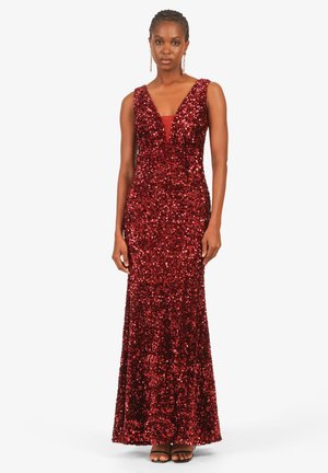 Rotes Paillettenkleid mit tiefem V-Ausschnitt, tailliertem Oberteil und schwingendem Rock. Verfügt über breite Träger und einen glatten Stoff darunter.