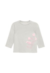 Lichtgrijs langslavige babyshirt met roze 3D bloemenapplicaties en geborduurde stelen en bladeren aan de rechtervoorzijde.