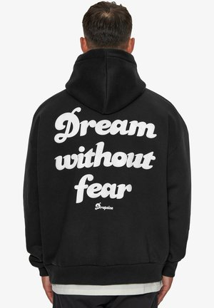 Black hoodie with a large white text design on the back reading "Dream without fear" and "Dropsize" logo, featuring a drawstring hood.