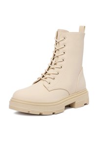 Beżowe botki za kostkę na sznurowaniu, wykonane z gładkiej skóry, z masywną podeszwą platformową z żłobieniami oraz uchwytem z tyłu.