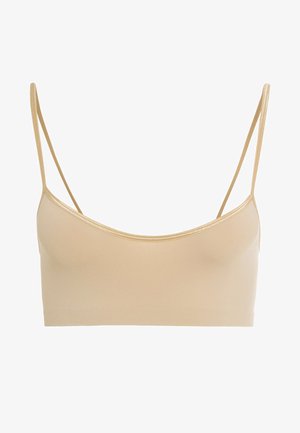 Beżowy stanik z elastycznego materiału z cienkimi ramiączkami, okrągłym dekoltem i gładką fakturą; brak widocznych elementów metalowych lub akcentów.