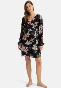 Black dress with long sleeves, floral pattern in pink, white, and olive green. V-neckline and cinched waist with drawstring detail.