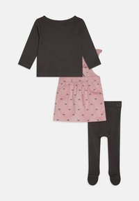Three-piece outfit: black long-sleeve top, pink skirt with bow pattern, and dark gray tights. Soft material, relaxed fit, and elastic waistband.