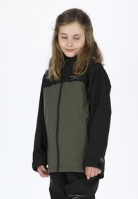 Children's jacket in black and olive green, made of synthetic material. Features a high collar, zip closure, and logo detail on chest.