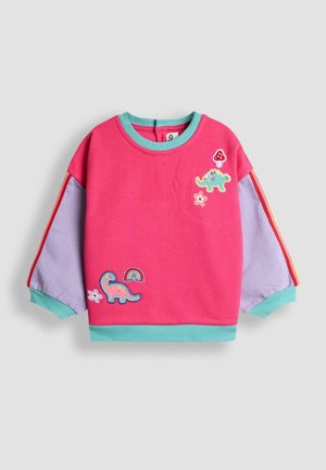 Roosa dressipluus türkiissiniste detailidega, dinosauruste ja vikerkaare tikandiga, pikad lillad varrukad ja soonikd.