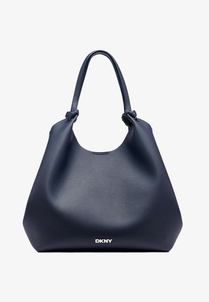 Marineblaue Leder-Hobo-Tasche mit einer glatten Oberfläche, einem einzelnen geknoteten Griff und weißem DKNY-Logo an der Basis, entworfen für den Casual-Einsatz.