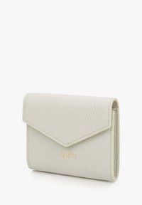 Light gray leather wallet with a textured finish, envelope-style flap, and gold logo accent. Compact design with sharp edges.