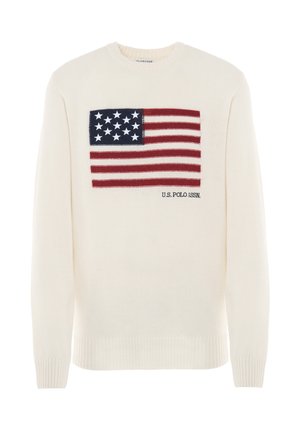Maglione color crema con un prominente design della bandiera americana in rosso e blu, con stelle bianche, esposto nella parte anteriore sopra il testo "U.S. POLO ASSN.".