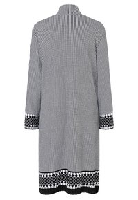 Tunika-Kleid im schwarz-weißen Hahnentrittmuster mit Kragen und drei Viertelärmeln. Schwarze und weiße gemusterte Abschlüsse an den Ärmeln und am Saum.