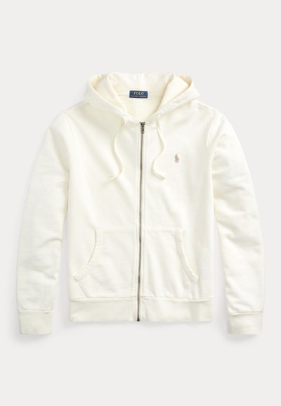 Sweatshirt de capuz creme claro com fecho de correr feito de tecido macio, apresentando um bolso canguru, cordões e um pequeno logótipo no peito.