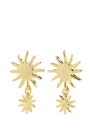 Boucles d'oreilles clous effet rayons de soleil en ton or avec de petits pendentifs rayons de soleil suspendus sous la grande base en forme de soleil.