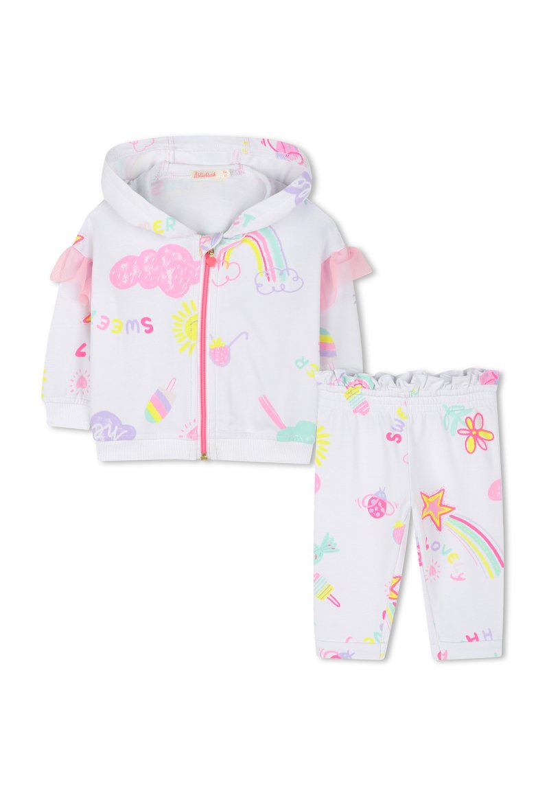 Witte hoodie-jack met roze rucheaccenten en kleurrijke speelse patronen, gecombineerd met bijpassende leggings met soortgelijke ontwerpen.
