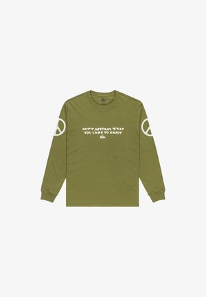 Oliivinvihreä pitkähihainen paita, jossa on valkoisia rauhan symboleita hihoissa ja valkoiset tekstit "ÄLÄ TUHOA SITÄ, MITÄ TULIT NAUTTIMAAN" edessä.