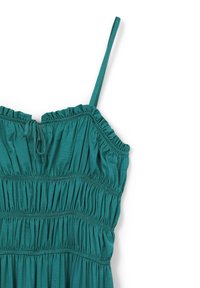 Türkises ärmelloses Kleid mit dünnen Trägern, gerafftem elastischem Oberteil und einer kleinen vorderen Schleifen-Dekoration auf weißem Hintergrund.