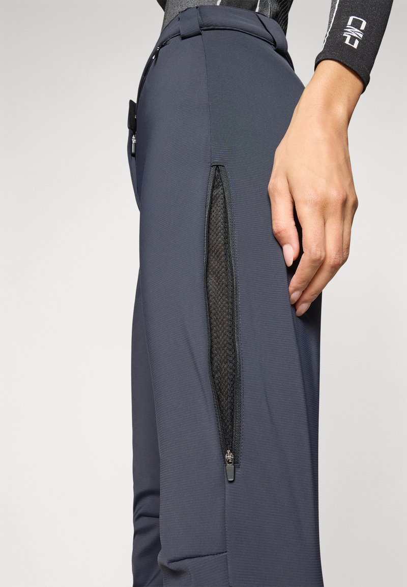 Pantaloni sportivi navy in tessuto testurizzato, con tasca laterale con zip in rete e un design slanciato.
