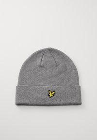 Bonnet en tricot gris avec un ourlet replié, présentant un logo d'oiseau brodé noir et jaune à l'avant. Texture douce et forme épurée.