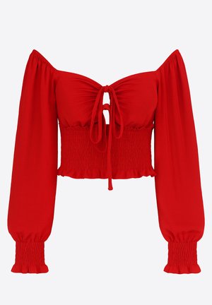 Haut court rouge à épaules dénudées, manches longues smockées, détail noué au centre et ourlet à volants. Fabriqué en tissu lisse et extensible.