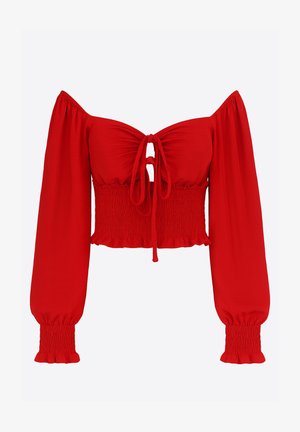 Top corto rosso con design a spalle scoperte, maniche lunghe arricciate, dettaglio con laccio centrale e orlo con volant. Realizzato in tessuto liscio ed elastico.
