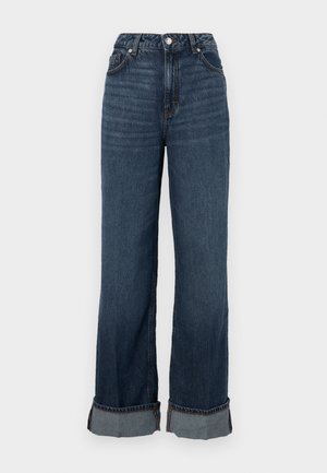 Augstas jostas platleņķu džinsi tumši zilos denimā, ar kontrastējošām šuvēm, salocītu apakšmalu un klasisku piecu kabatu dizainu.