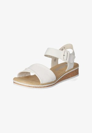 Hvide sandaler med en glat læderoverdel, justerbar ankelrem og en korkvamp. Har et bredt, blødt bånd tværs over fronten.
