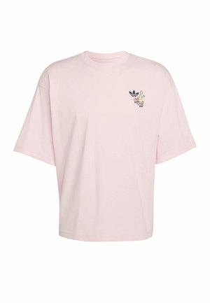 Hellrosa übergroßes T-Shirt mit kleinem Grafikmotiv des Adidas-Logos und einer gelben Banane auf einem rosa Skateboard auf der linken Brust.