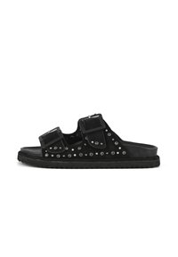 Black suede slide sandals featuring two adjustable straps, studded accents, and a textured rubber sole.