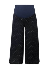 Culotte nere con design a gamba larga, caratterizzate da una morbida vita blu navy e da pois bianchi distribuiti uniformemente su tutto il tessuto.