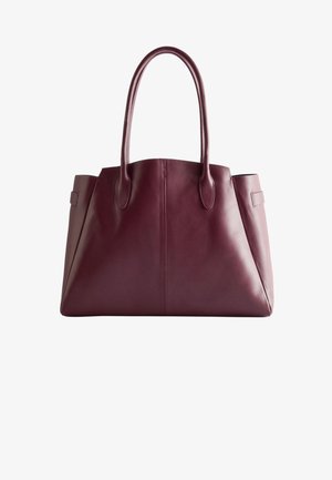 Burgunderfarbene Leder-Shopper-Tasche mit langen Griffen, einem strukturierten Körper, auffälligen Nähten und flachen Seiten. Keine sichtbaren Beschläge oder Verzierungen.