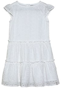 Biała bawełniana sukienka z wzorem ażurowych kropek, falbanami u dołu i krótkimi, nakładanymi rękawkami. Zapięcie z tyłu na guziki.