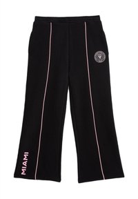 Pantalones de chándal negros con un corte holgado, que presentan franjas laterales rosas y un gráfico de "MIAMI" impreso en rosa en la parte inferior de la pierna izquierda.