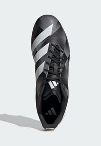 Crne nogometne kopačke s teksturiranim gornjim dijelom, opremljene bijelim dijagonalnim prugama i čvrstim vezanjem. Elegantan dizajn s aerodinamičnim oblikom.