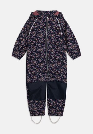 Combinaison de pluie une pièce bleu marine pour enfants avec motif floral rose, capuche, fermeture éclair à l'avant, renforts noirs aux genoux et étriers aux chevilles.