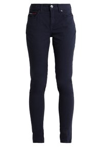 Jeans skinny azul marino hechos de una mezcla de algodón, con cinco bolsillos y un cierre de botón en la parte delantera. Textura suave con sutiles detalles de costura.