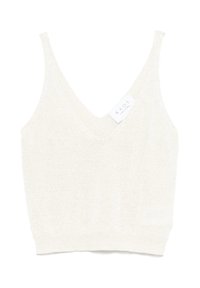 Top in maglia color beige chiaro con scollo a V profondo e spalline sottili. Texture morbida e silhouette aderente, con orlo cucito e etichetta del marchio.