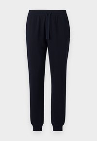Pantalones de chándal de color navy fabricados con un tejido suave, que cuentan con una cintura elástica con cordón, perneras ajustadas y puños acanalados en los tobillos.
