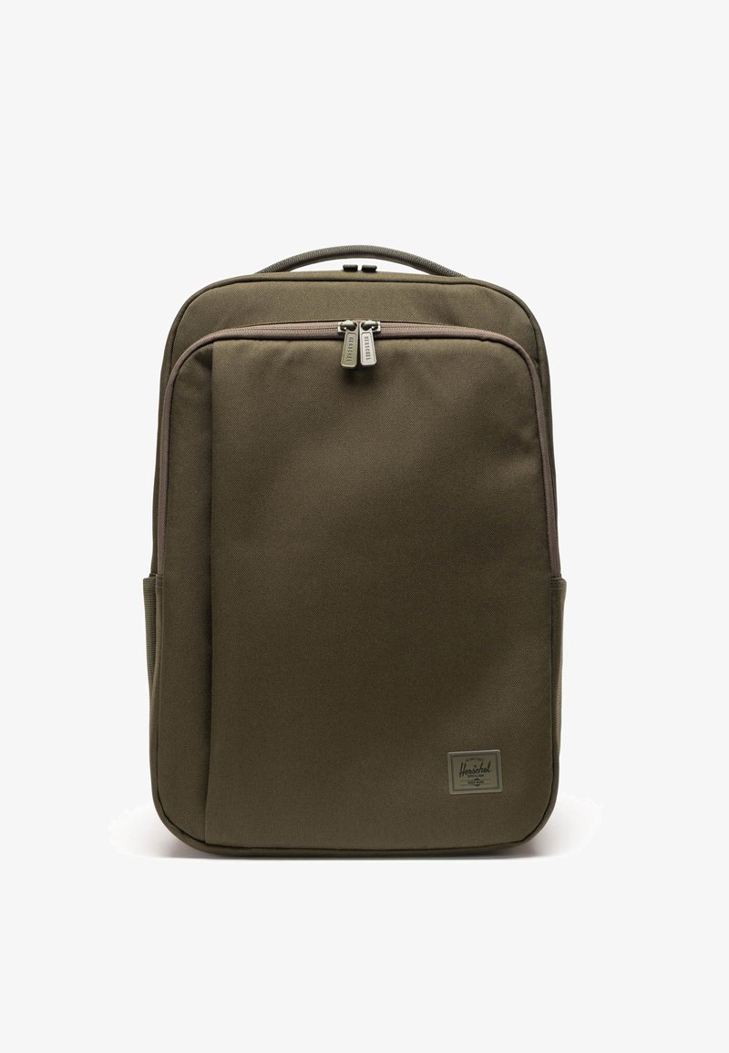 Olive green backpack with a rectangular shape, made of durable fabric, features two zippers, front pocket, and a logo patch.