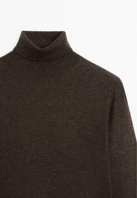 Dark brown turtleneck sweater made of soft knit material, featuring a high collar and smooth texture, with a fitted silhouette.