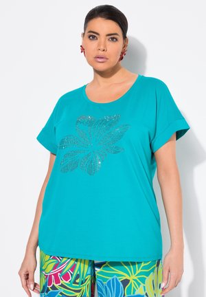 Turkise kortærmet t-shirt med rund halsudskæring og et blomsterdesign i sølv rhinsten. Blødt stof med en afslappet pasform.