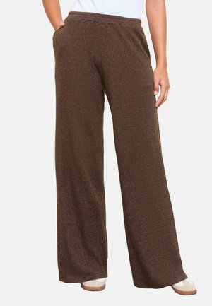 Barna bordázott, széles szárú nadrág, elasztikus derékkal. Oldalsó zsebekkel és struktúrált anyaggal rendelkezik, a kényelem és a mindennapi viselet érdekében tervezve.